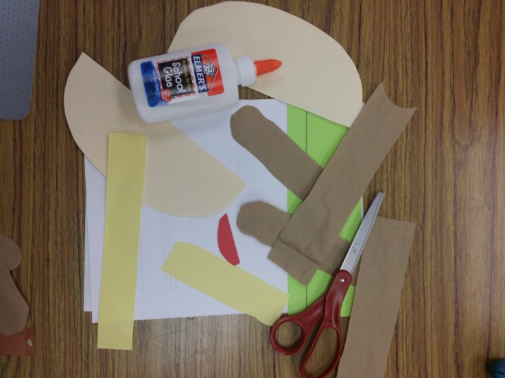 Cut up these prior to start. I used a paper bag, chunks of red and green construction paper and a folder to cut out the buns.